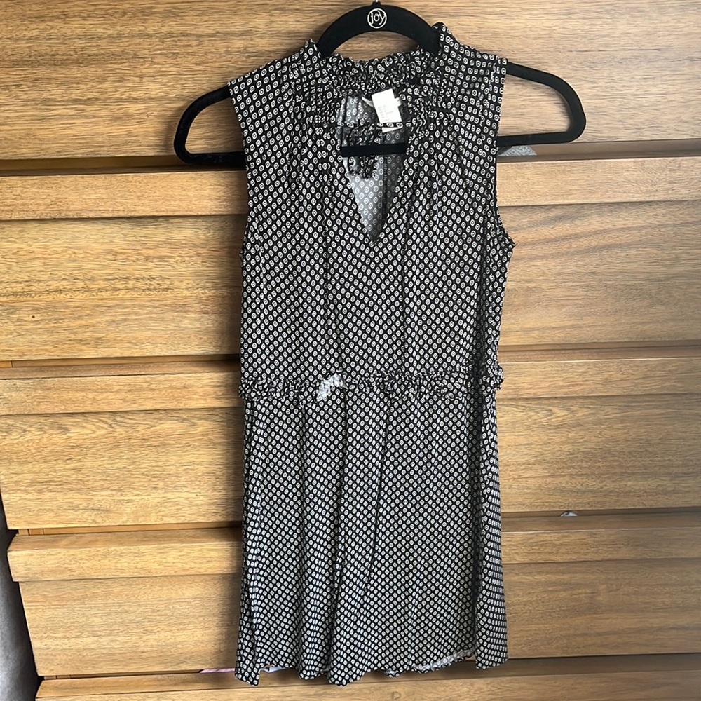 Deep V, patterned work dress that falls right below the kneee